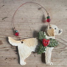 Load image into Gallery viewer, Decorative dog ornament with berries and leaves on a wooden surface