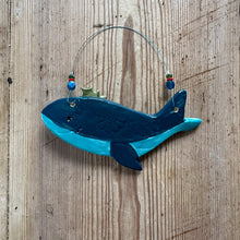 Load image into Gallery viewer, Blue whale-shaped clay decoration on a wooden surface