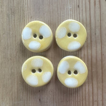 Load image into Gallery viewer, Four yellow buttons with white polka dots on a wooden surface