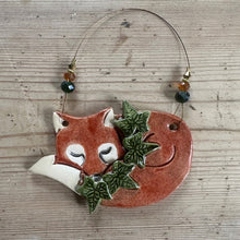 Load image into Gallery viewer, Ceramic fox ornament with leaves on a wooden surface
