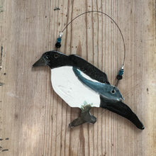 Load image into Gallery viewer, Decorative magpie ornament on a wooden surface