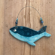 Load image into Gallery viewer, Decorative whale-shaped object on a wooden surface