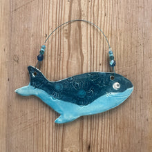 Load image into Gallery viewer, Decorative whale-shaped ceramic decoration on a wooden surface
