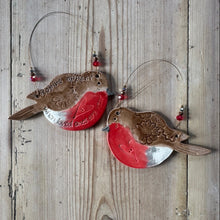 Load image into Gallery viewer, Two ceramic robin bird ornaments on a wooden background