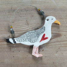 Load image into Gallery viewer, Decorative seagull ornament on a wooden surface