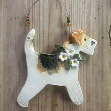 Load image into Gallery viewer, Decorative dog-shaped ornament with flowers on a wooden surface