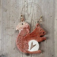 Load image into Gallery viewer, Decorative ceramic squirrel ornament on a wooden surface