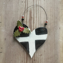 Load image into Gallery viewer, Decorative ornament with black and white Cornish St Piran's Flag design on a wooden surface