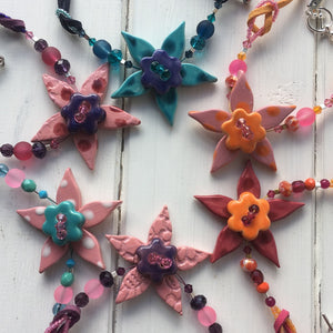 Flower necklaces on suede