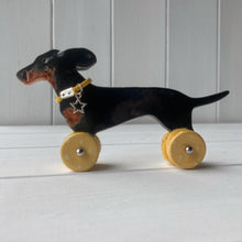 Load image into Gallery viewer, Wind Blown Black & Tan Dachshund "Woof on Wheels"