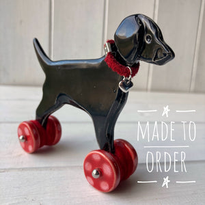 Black Labrador Ceramic "Woof on Wheels" Ornament