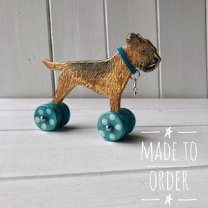 Border Terrier "Woof on Wheels" with sticky up ears