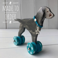 Load image into Gallery viewer, Weimaraner Ceramic "Woof on Wheels" Ornament