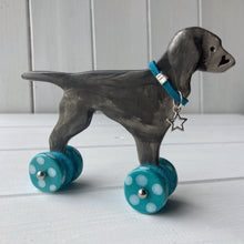 Load image into Gallery viewer, Weimaraner Ceramic "Woof on Wheels" Ornament