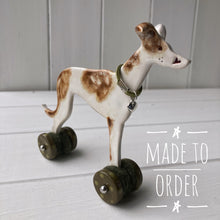 Load image into Gallery viewer, Greyhound Ceramic &quot;Woof on Wheels&quot; Ornament

