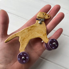 Load image into Gallery viewer, Yellow Labrador Ceramic "Woof on Wheels" Ornament