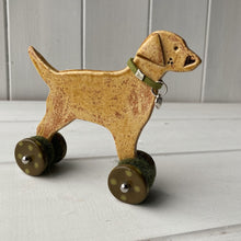 Load image into Gallery viewer, Yellow Labrador Ceramic "Woof on Wheels" Ornament