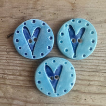 Load image into Gallery viewer, Blue ceramic buttons with heart designs on a wooden surface

