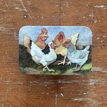 Load image into Gallery viewer, Decorative tin with cartoon-style chickens on a wooden surface
