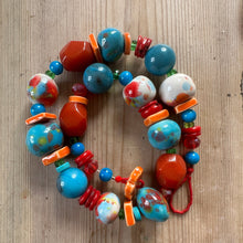Load image into Gallery viewer, Colourful beaded bracelet on a wooden surface

