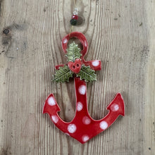 Load image into Gallery viewer, Red anchor-shaped ornament with white polka dots and holly leaves on a wooden surface

