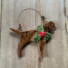 Load image into Gallery viewer, Decorative labrador ornament with holly on a wooden surface

