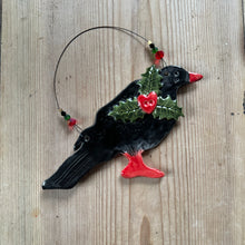 Load image into Gallery viewer, ceramic chough ornament with holly on a hand
