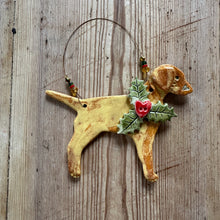 Load image into Gallery viewer, Decorative ceramic labrador ornament with holly on a wooden surface

