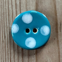 Load image into Gallery viewer, Blue button with white spots on a wooden surface
