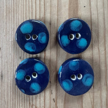 Load image into Gallery viewer, Four blue buttons with turquoise dots on a wooden surface
