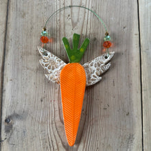 Load image into Gallery viewer, Decorative carrot with gold wings on a wooden surface
