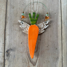 Load image into Gallery viewer, Decorative carrot with lace wings on a wooden surface
