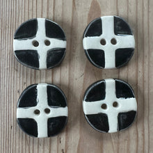 Load image into Gallery viewer, Four black and white checkered buttons on a wooden surface
