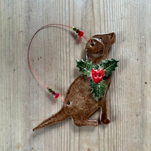 Load image into Gallery viewer, Decorative curly retriever ornament with holly and red berry on a textured surface
