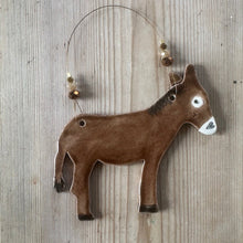 Load image into Gallery viewer, Decorative brown donkey ornament on a wooden surface
