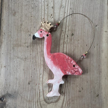 Load image into Gallery viewer, Pink flamingo ornament with a gold crown on a wooden surface
