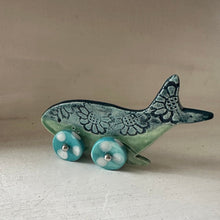 Load image into Gallery viewer, Ceramic whale on wheels with teal &amp; turquoise design on a beige background
