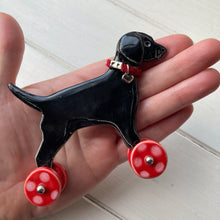 Load image into Gallery viewer, Black Labrador Ceramic &quot;Woof on Wheels&quot; Ornament
