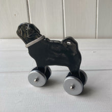 Load image into Gallery viewer, Black Pug &quot;Woof on Wheels&quot; ceramic ornament
