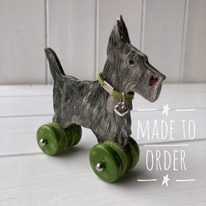 Black Cairn Terrier "Woof on Wheels"