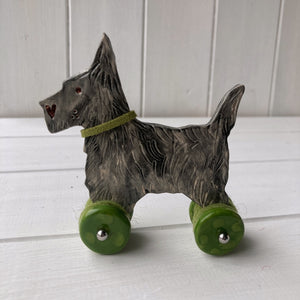 Black Cairn Terrier "Woof on Wheels"