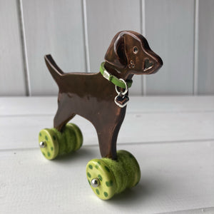Chocolate Labrador Ceramic "Woof on Wheels" Ornament