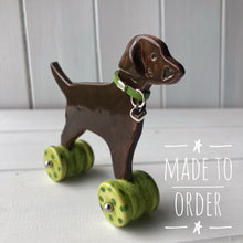 Load image into Gallery viewer, Chocolate Labrador Ceramic &quot;Woof on Wheels&quot; Ornament
