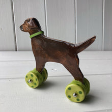 Load image into Gallery viewer, Chocolate Labrador Ceramic &quot;Woof on Wheels&quot; Ornament
