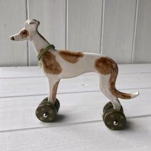 Load image into Gallery viewer, Greyhound Ceramic &quot;Woof on Wheels&quot; Ornament
