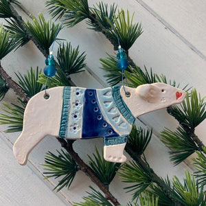 ceramic polar bear decoration  wearing a blue patterned jumper