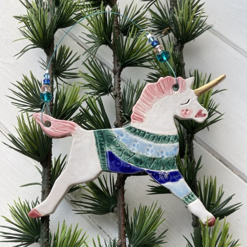 Ceramic unicorn in a jumper decoration