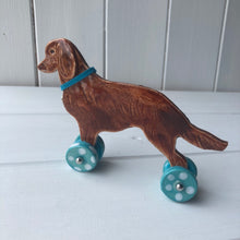 Load image into Gallery viewer, Flat Coated Retriever &quot;Woof on Wheels&quot;, Ceramic Ornament
