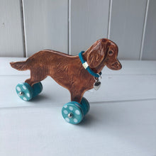 Load image into Gallery viewer, Flat Coated Retriever &quot;Woof on Wheels&quot;, Ceramic Ornament
