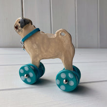 Load image into Gallery viewer, Pug &quot;Woof on Wheels&quot; ceramic ornament
